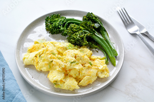 Cheesy scrambled eggs with broccolini