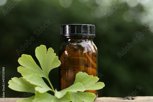 Ginkgo biloba tablets.Alternative medicine and homeopathy. Brown glass jar with pills ,ginkgo biloba leaves on a blurred background . ginkgo biloba extract