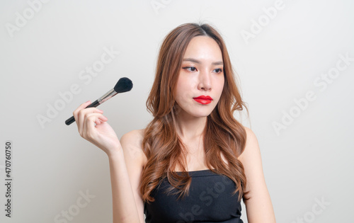 portrait beautiful woman with makeup brush