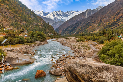 Baspa mountain river valley with scenic landscape and Himalaya snow peaks at Rakchham Himachal Pradesh, India