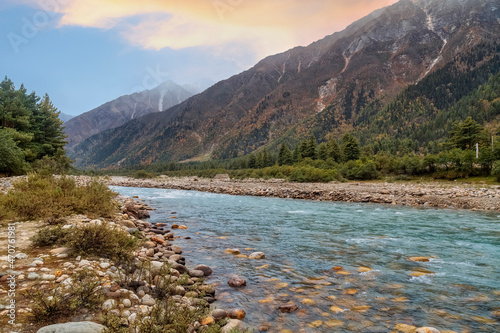 Baspa river flowing through scenic Himalaya mountain landscape at Sangla Himachal Pradesh, India photo