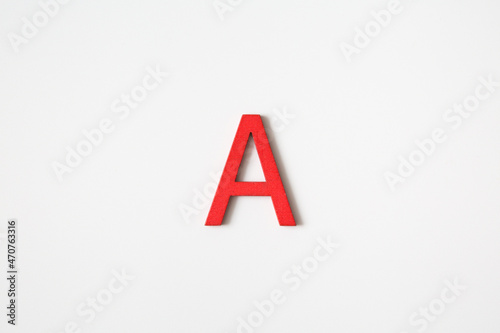 Red wooden english letters "A" on white background