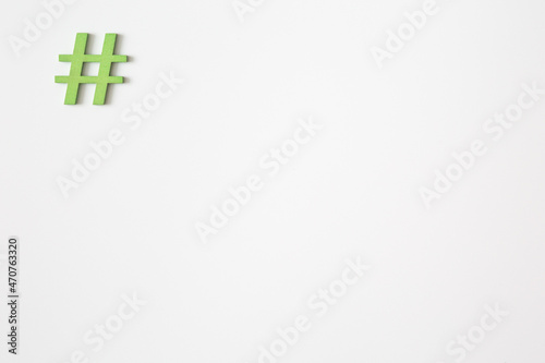 Green wooden symbol Hashtag 