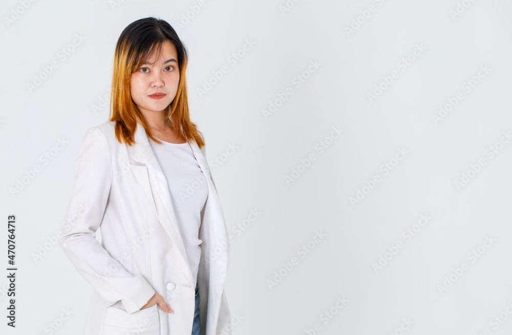Portrait studio shot of Asian trendy fashionable urban beautiful happy dyed hair female model in casual long suit t shirt and denim jeans standing smiling look at camera posing on white background Portrait studio shot of Asian trendy fashionable urban beautiful happy dyed hair female model in casual long suit t shirt and denim jeans standing smiling look at camera posing on white background