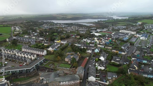 Kinsale, Ireland. Flying Above Residential Neighborhood, Row Houses With Mist on River Brandon, Drone Shot photo