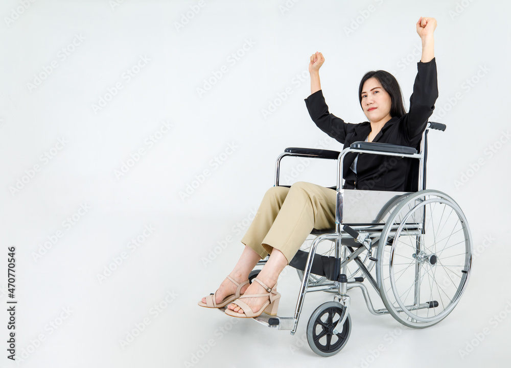 Obraz premium Strong Asian paralysis woman on rehabilitation wheelchair intentionaly pointing finger to higher medication goal to fight disability problem from accident injury