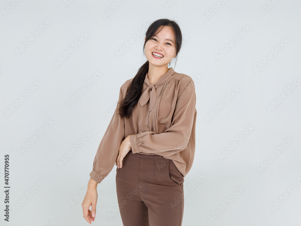 Lovely Asian girl cheerfully laugh and smile on happy face with attractive charming brown blouse as casual outfit for female lifestyle Lovely Asian girl cheerfully laugh and smile on happy face with attractive charming brown blouse as casual outfit for female lifestyle