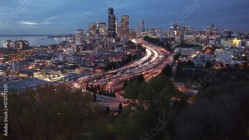 Cinematic 4K aerial drone night pedestal shot of downtown Seattle Central Business District, First Hill, Yesler Terrace, Atlantic, freeway interchange, skyscrapers viewed from North Beacon Hill photo