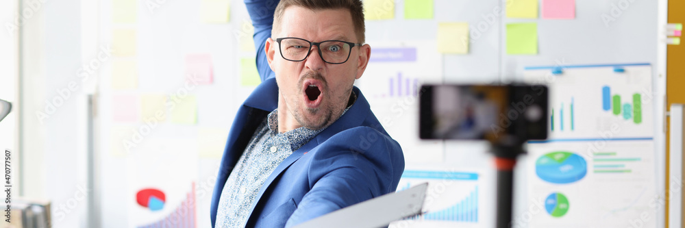 Emotionally motivated male coach conducts online business training Emotionally motivated male coach conducts online business training