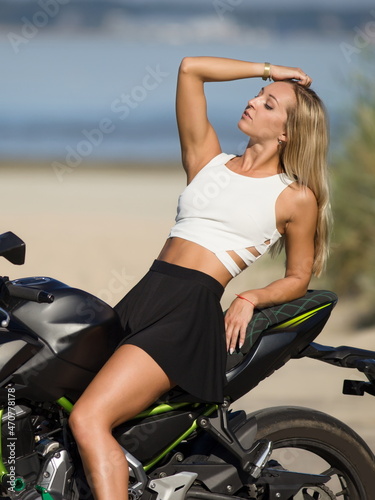 young woman with a sports motorcycle