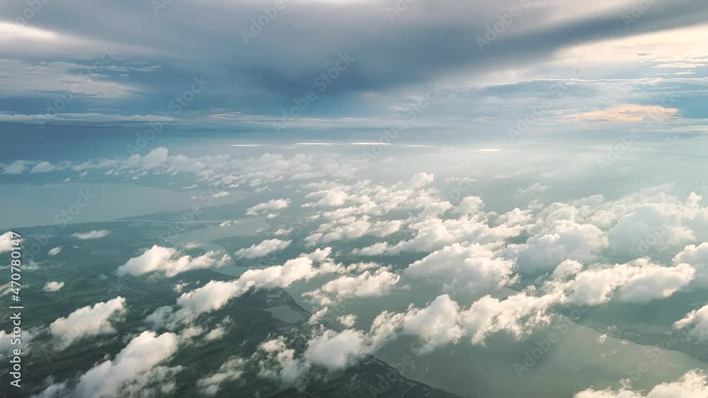 Aerial view from airplane.
Flying above clouds, forest, lake and mountain. Aerial footage. Aerial view from airplane.
Flying above clouds, forest, lake and mountain. Aerial footage.