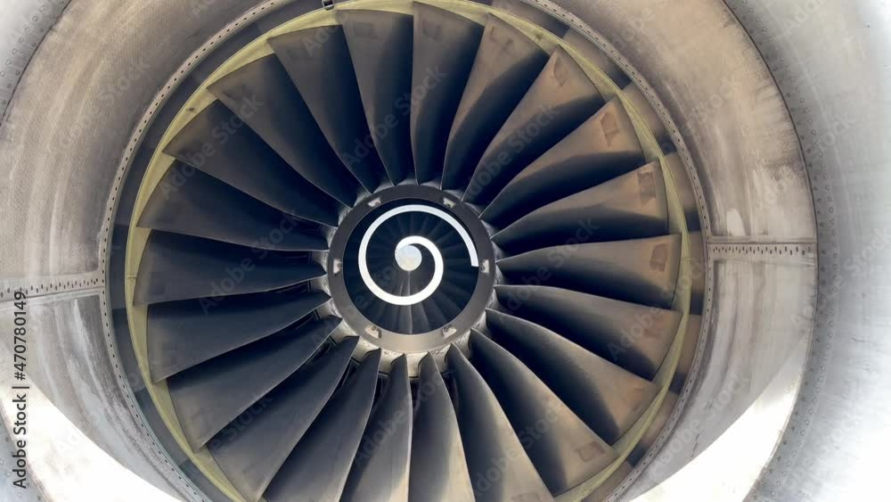 The rotation of airplane engine. Front view of aircraft engine turning. Jet engine rotation in