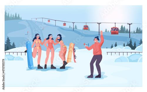 Snowboarder girls in bikini taking a picture in front of a cableway.