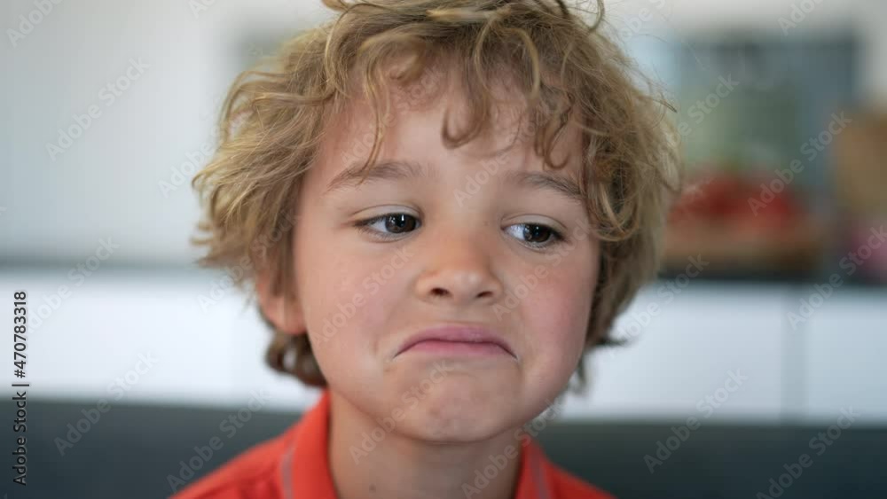 Little boy becoming sad. Disapointed child expression Little boy becoming sad. Disapointed child expression