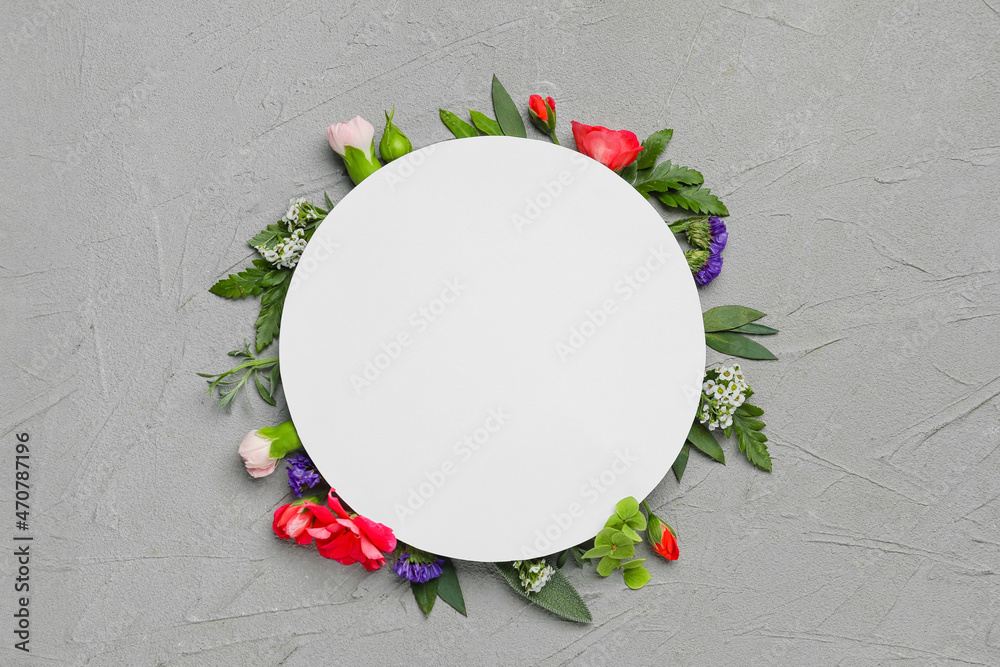 Composition with blank card and different flowers on grey background - obrazy, fototapety, plakaty 