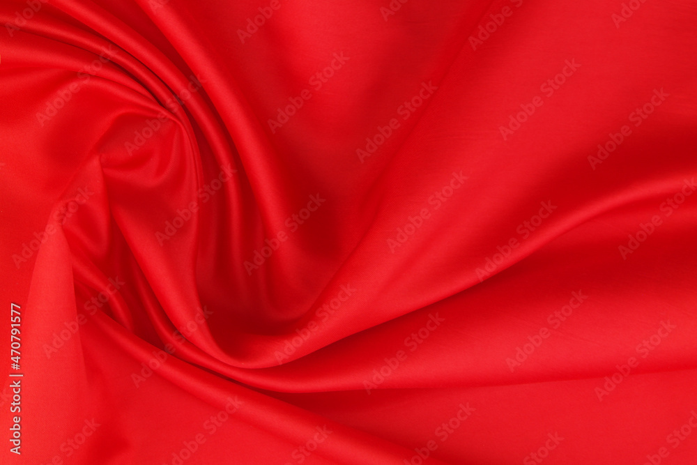Red satin or silk fabric backdrop. Beautiful wallpaper, wedding background or design element.	