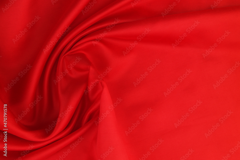 Red satin or silk fabric backdrop. Beautiful wallpaper, wedding background or design element.	