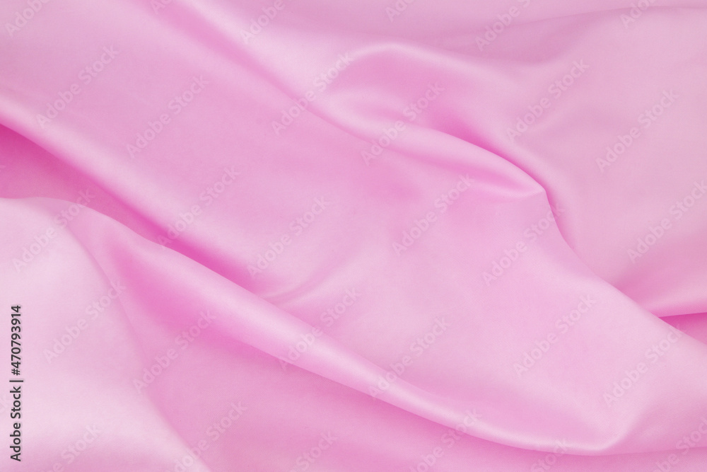 Pink satin or silk fabric background. Pink satin or silk fabric background.
