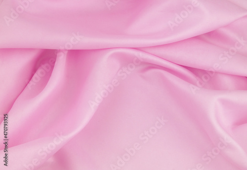 Pink satin or silk fabric background. 