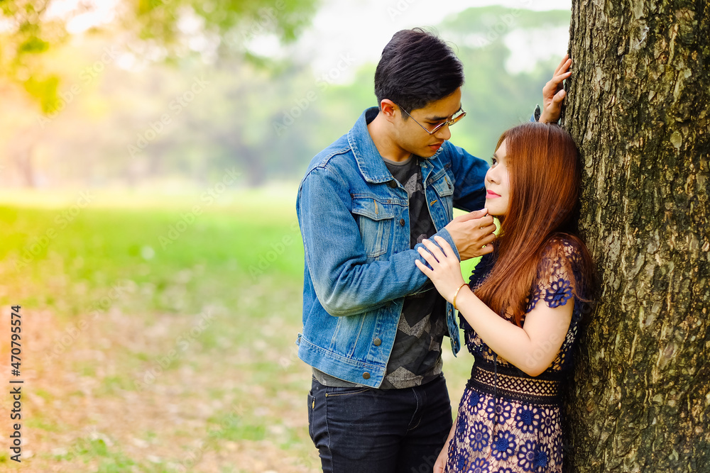 Portrait asia young couple in love, boyfriend and girlfriend happy in park