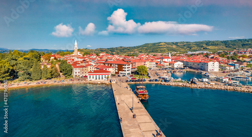 Aerial landscape photography. Colorful summer cityscape of Izola town, Slovenia. Morning seascape of Adriatic sea. View from flying drone of old sea port. Сharm of the ancient cities of Europe. #470796940