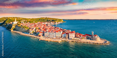 Obraz na płótnie Сharm of the ancient cities of Europe. Bright morning cityscape of Piran town. Stunning summer scene of Slovenia’s Adriatic coast with beautiful Venetian architecture. View from flying drone. w salonie