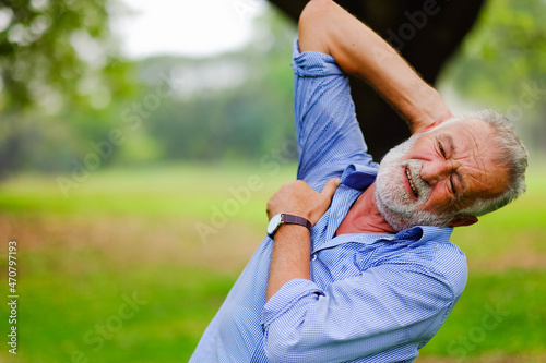 caucasian old man in park, He have pains and aches after exercise