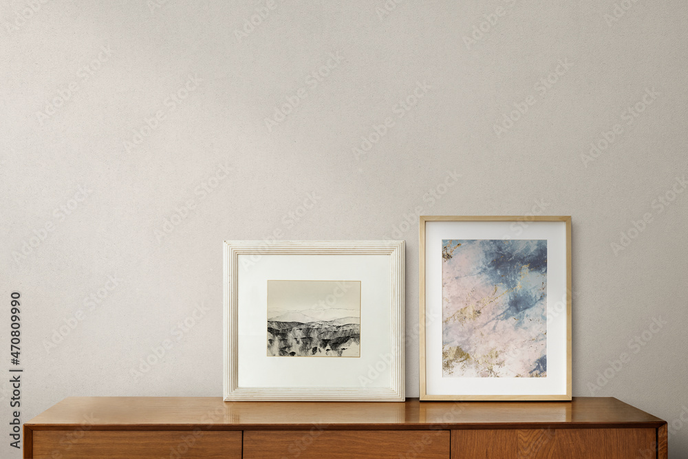 Fototapeta premium Picture frames on a wooden cabinet