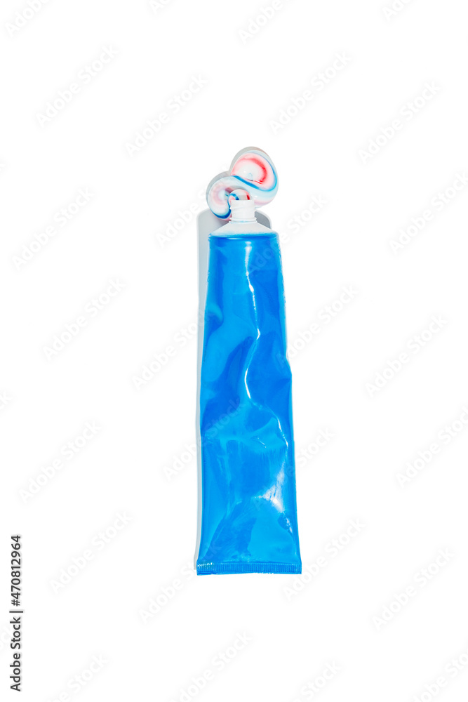 Dental blue tube with squeezed out toothpaste in white, red and blue ...