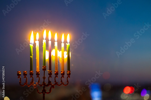 The sixth day of Hanukkah. Light six candles in the menorah. Hannukia on the windowsill. Traditions of the religion of Judaism. The main holiday of the Jews. Sunset night