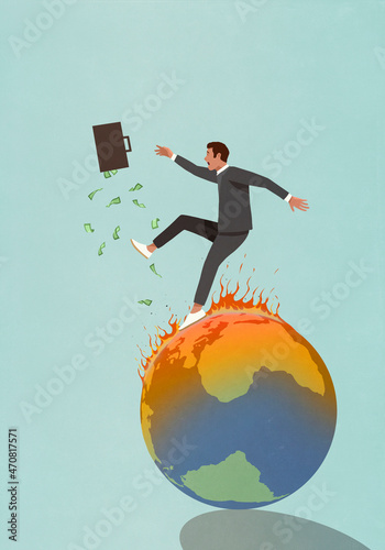 Businessman with briefcase of money falling on burning globe
 photo
