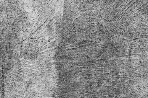 Stare szare tło powierzchni ściany po spoinowaniu kleju szpachlowego z teksturą pęknięć. © Janusz