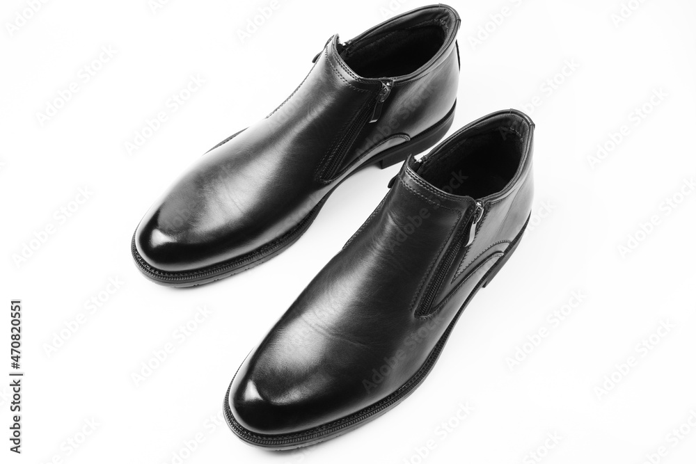 New black shoes for men with zippers isolated on a white background. Men's comfortable shoes. Top view, flat lay. New black shoes for men with zippers isolated on a white background. Men's comfortable shoes. Top view, flat lay.