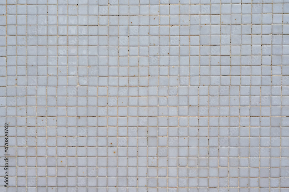 Simple textured light background of wall of building with grey square