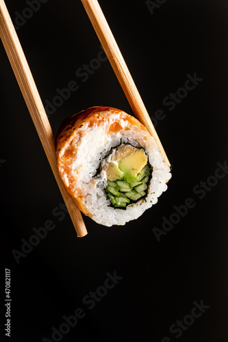 tasty sushi with fresh fish and vegetables