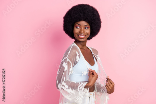 Photo portrait curly girl looking empty space dreamy cheerful smiling isolated pastel pink color background