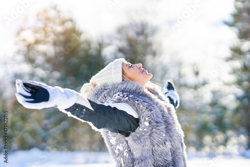 Nice young happy woman in winter scenery