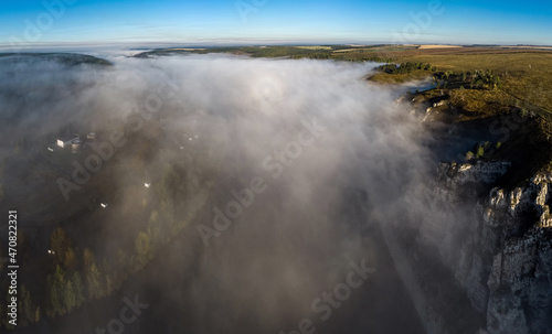 Aerial view of the Belaya river in fog © tilpich
