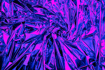 Neon background foil with purple and blue light. Psychedelic abstract gradient texture. Crazy wallpaper.