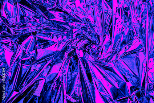 Neon background foil with purple and blue light. Psychedelic abstract gradient texture. Crazy wallpaper. photo