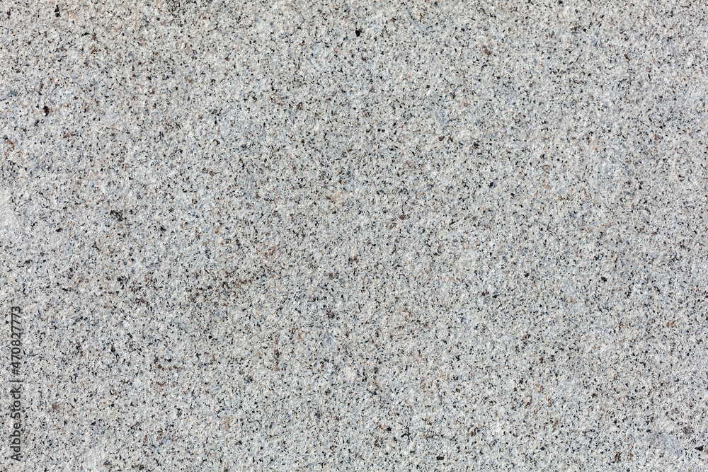 Old wall stone granite texture with a grey and black abstract colour background design, stock photo image