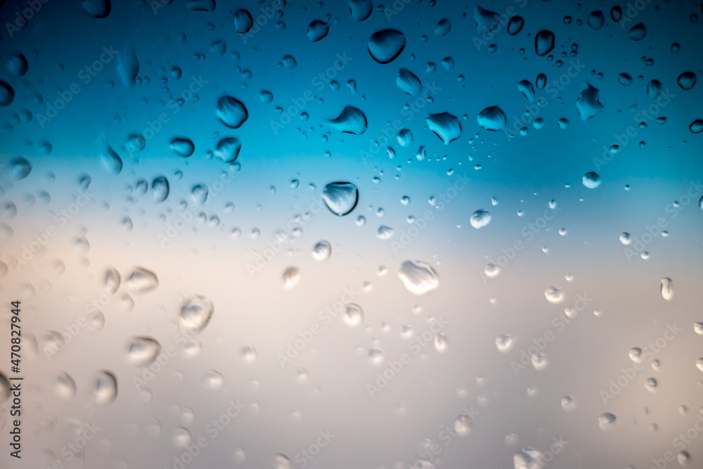 Rain drops on window glass outside texture background water