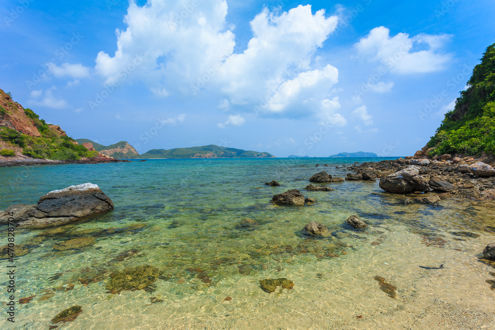 Tropical island rock on the beach with blue sky. Koh kham pattaya thailand 
