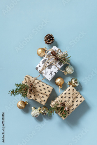 Christmas tree made of Christmas gifts and decor. Top view flat lay background. Copy space. © elena_hramowa
