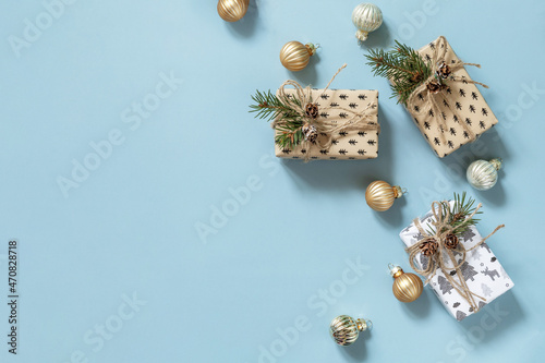 Christmas mockup with Christmas presents on a blue background. Preparation for celebration xmas. Top view flat lay background. Copy space. © elena_hramowa
