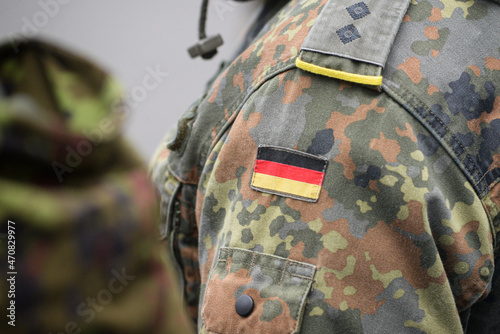 Uniform of the German army with the German flag on the shoulder. German military, selective focus. photo