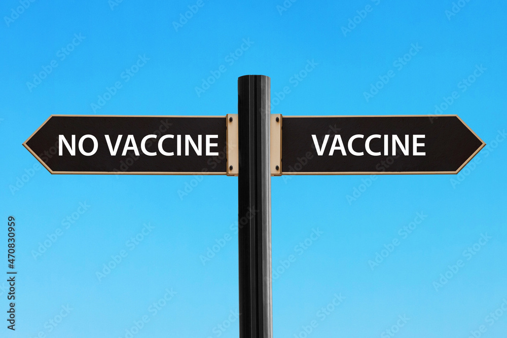 Road sign symbolizing decision between vaccine or no vaccine Road sign symbolizing decision between vaccine or no vaccine