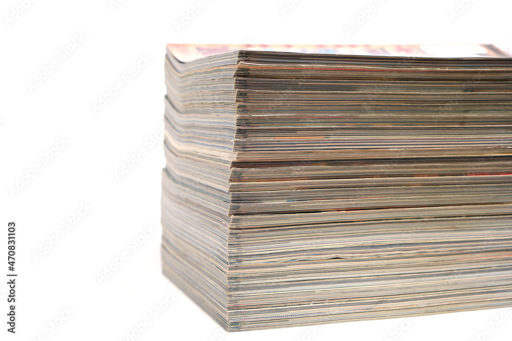Stack of magazines and newspapers on a white background. Stack of magazines and newspapers on a white background.