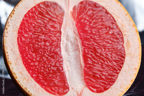 Half a grapefruit as an erotic concept. Symbolic image of the vagina of the hymen. Close-up. Selective focus photo