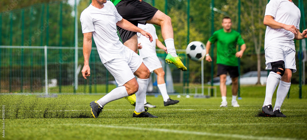 Group of Adult Soccer Players in a Duel. Footballers Kicking Match on Grass Field. Football Forward and Defensive Player in Competition